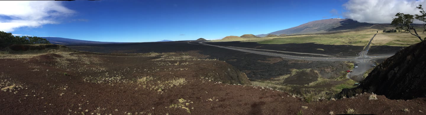 Mauna Loa, Mauna Kea, and Hualālai seen from Puʻuhuluhulu across the 1935 Humuʻula lava flow.